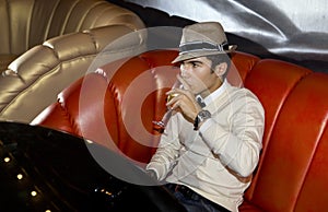 Man on sofa in night club