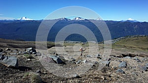 Man solo hiking up mountainside volcano Puyehue, Puyehue National Park, Chile, Patagonia. Volcanoes