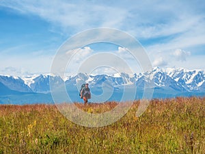 Man solo traveler hiking in mountains, adventure solo traveling lifestyle concept, active weekend vacations on the wild nature