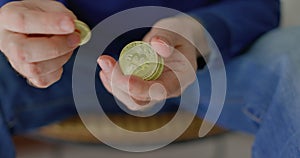 Man with some bitcoins in his hands in closeup