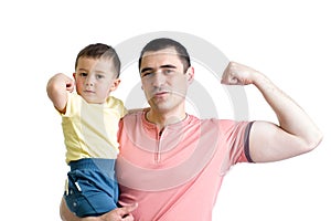 Man and son kid showing muscles