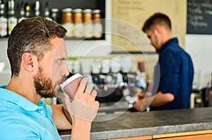 Man speak mobile phone and drink coffee cafe bar background. Traditional beginning of his day. Man solving problems