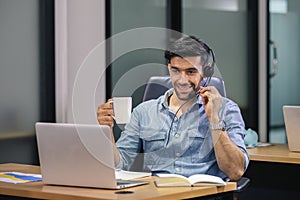 Man speaking microphone with headset looking laptop, work new normal.