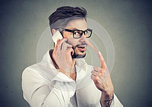 Man speaking on phone and lying