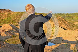 The man specifies in a distance