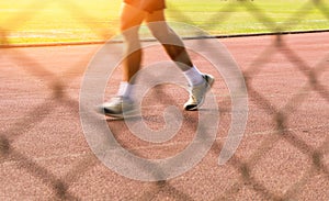 Man speed motion Running on track in Sport Stadium