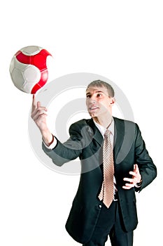 Man spinning a football on his finger