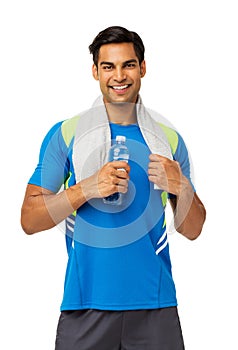 Man In Sports Clothing Holding Water Bottle And Towel