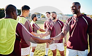 Man, sports and handshake for team greeting, introduction or sportsmanship on the grass field outdoors. Sport men