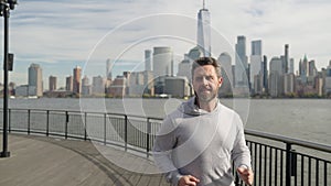 Man sportsman running for exercise in active wear. Sportsman jogger running. Sport runner in Manhattan. Sportsman