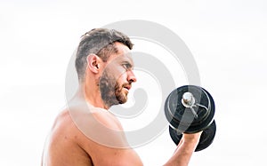 Man sportsman weightlifting. steroids. fitness and sport equipment. Muscular man exercising in morning with barbell