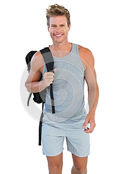 Man in sportswear holding rucksack