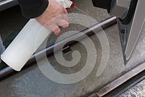 Man Spraying Car Soap for Washing a Car