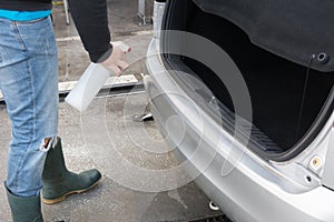 Man Spraying Car Soap for Washing a Car