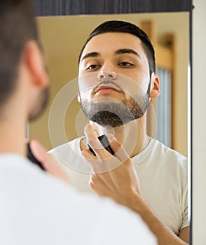 Man spraying fragrance perfume