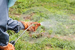 A man is spraying herbicide