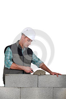 Man spreading mortar