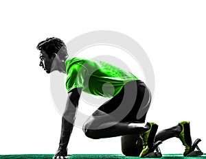 Man sprinter runner in starting blocks silhouette photo