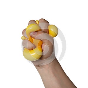 Man squeezing yellow stress ball on white background, closeup