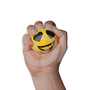 Man squeezing yellow stress ball on white background, closeup