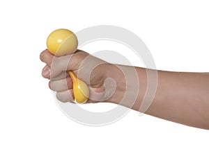 Man squeezing yellow stress ball on white background, closeup