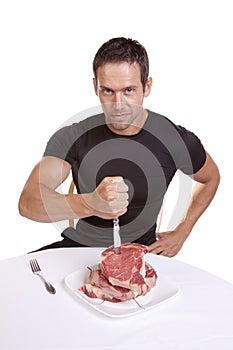 Man stabbing steaks