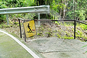 Man on Stairs going down sign symbol beside the street in the park background. Walk down sign with handrail in the garden