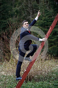 The man on the stairs. A man in a suit climbs up. Business Climbing.