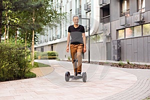 man stand near segway hoverboard