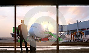 man standing at airport departure hall view windows