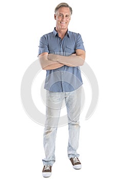 Man Standing Arms Crossed Against White Background photo