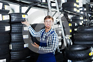 Man standing with auto tires