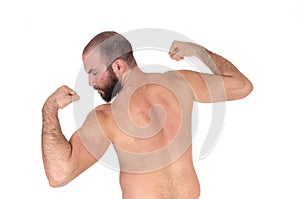 Man standing from back shirtless showing his muscles