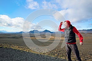Man standing on the background of the mountains in Iceland