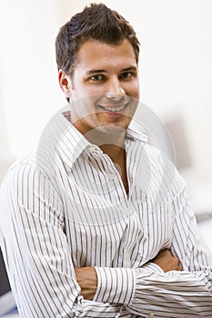 Man standing in computer room smiling