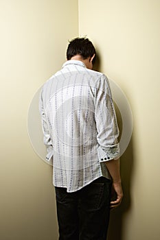 Man standing in corner