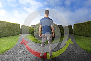 Man standing at crossroads. Choice between different ways