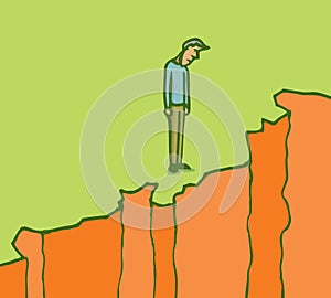 Man standing on the edge of a cliff