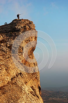 Man standing on edge of the cliff