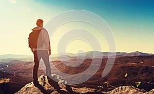 Man standing at the edge of a cliff