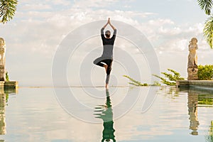 A man standing at the edge of infinity pool