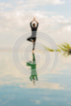 A man standing at the edge of infinity pool
