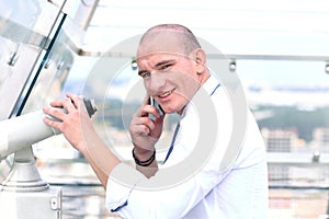 Man standing on the edge and looking at the city