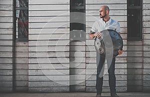 Man is standing eith hangdrum