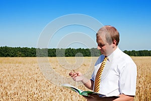 A man standing in field of wheat