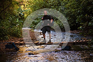 Man Standing on Footbridge