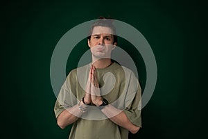 Man Standing in Front of Green Wall