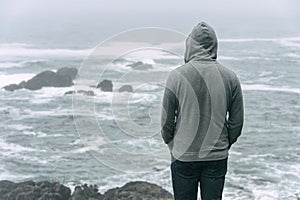 Man standing in front of the pacific ocean