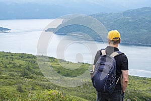 Man Standing and Gazing Out to Bonne Bay Fjord