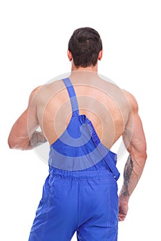 A man is standing with his back in a blue uniform on a white isolated background